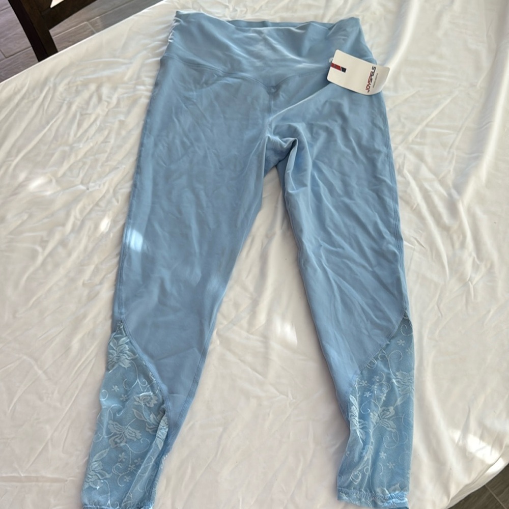 Brand new light, blue leggings size large